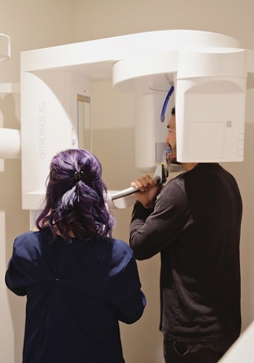 team member giving patient a xray