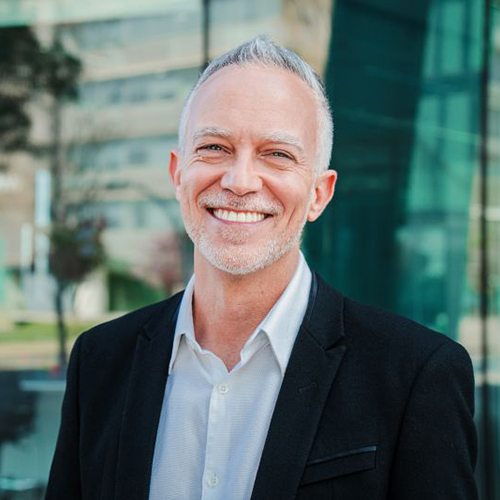Confident, smiling senior man in professional attire